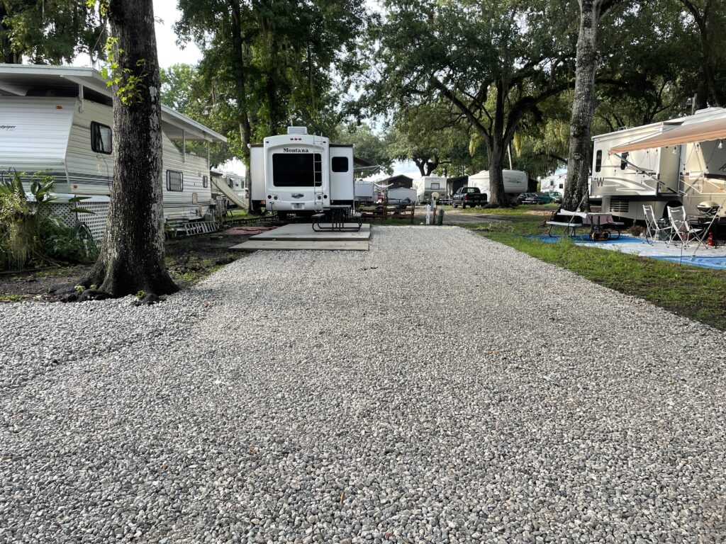 Gravel RV site with full hookups at Cape Kennedy RV Park and Campground near Cocoa Beach, Florida